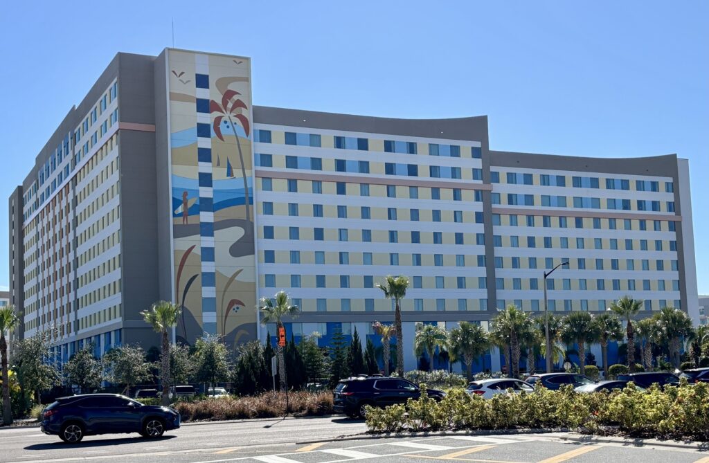 Surfside Inn and Suites tower with colorful surf mural and palm trees at Universal Orlando Resort