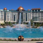 Universal Helios Grand Hotel behind the Cosmos Fountain at Universal Epic Universe in Orlando, Florida