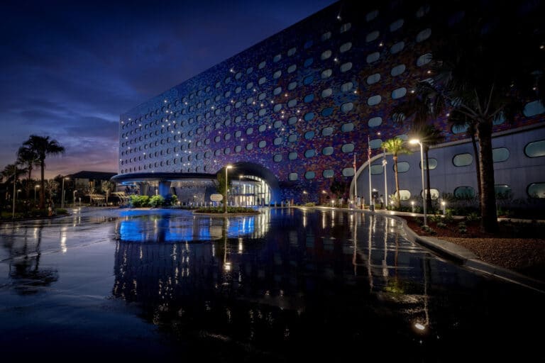 Illuminated exterior and reflecting pool at Universal Stella Nova Resort at Universal Orlando