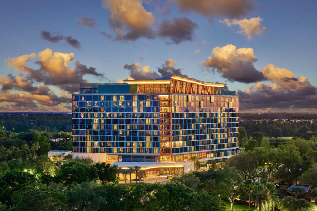 Walt Disney World Swan Reserve exterior illuminated at sunset