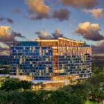 Walt Disney World Swan Reserve exterior illuminated at sunset