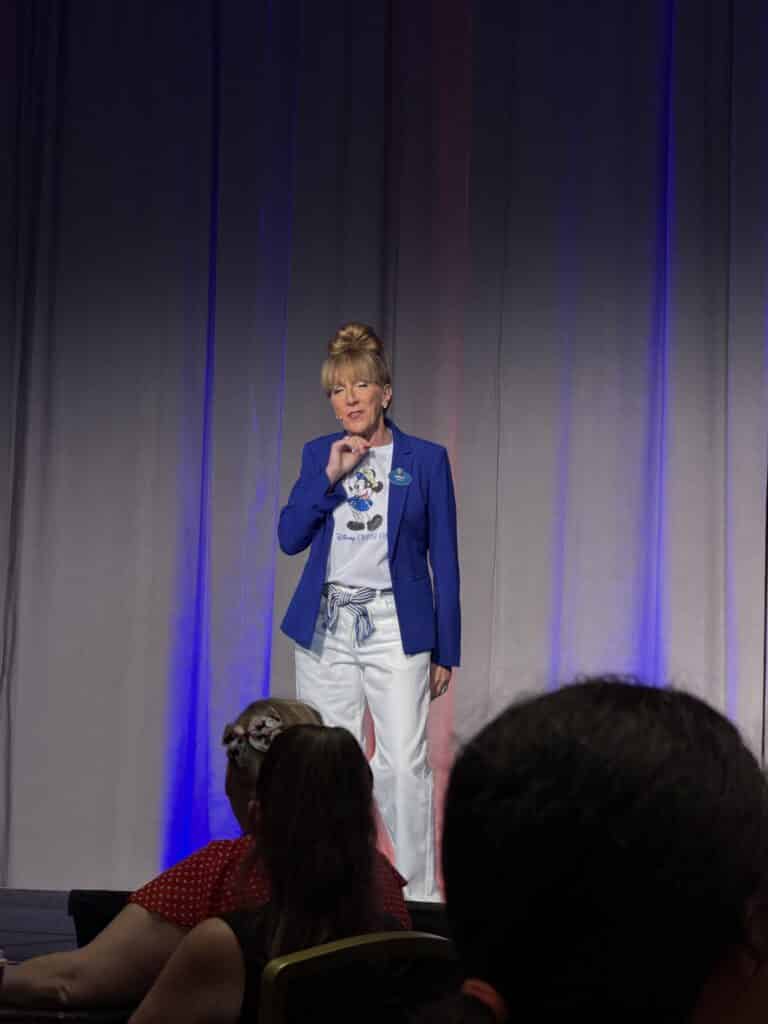 Speaker presenting at the Disney Believe reveal event