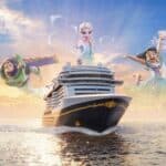 Disney Believe promotional artwork with Buzz Lightyear, Elsa and Mirabel above the ship