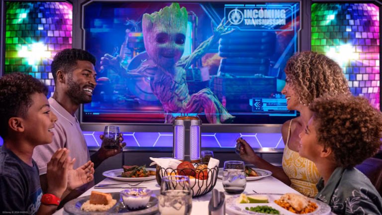 Family dining at Worlds of Marvel with Groot on a screen
